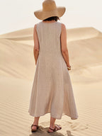 Cotton women's dress featuring a relaxed fit, stylish pockets, and a comfortable design, perfect for casual outings or everyday wear. 1