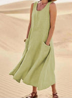 Cotton women's dress featuring a relaxed fit, stylish pockets, and a comfortable design, perfect for casual outings or everyday wear. 11