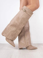 Knee high boots with a stylish flared top and comfortable block heel, perfect for fashionable fall and winter outfits. 6