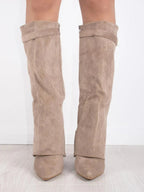 Knee high boots with a stylish flared top and comfortable block heel, perfect for fashionable fall and winter outfits. 7
