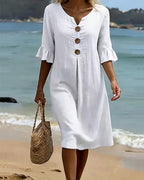 White summer dress featuring ruffled sleeves, made from a soft cotton-linen blend, perfect for warm weather outings and casual occasions. 1