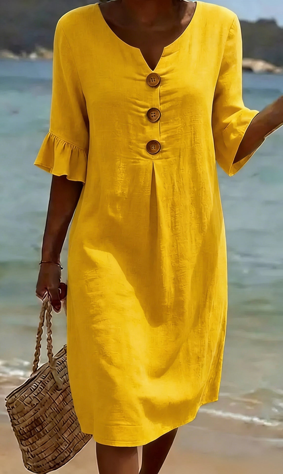 White summer dress featuring ruffled sleeves, made from a soft cotton-linen blend, perfect for warm weather outings and casual occasions. 6
