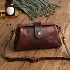 Women's compact adjustable crossbody bag featuring a stylish magnetic flap closure, perfect for hands-free convenience and organized storage. 1