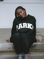 Women's oversized sweatshirt featuring soft chenille lettering, perfect for casual everyday wear and stylish comfort. 12