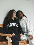 Women's oversized sweatshirt featuring soft chenille lettering, perfect for casual everyday wear and stylish comfort. 14