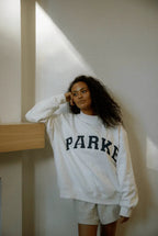 Women's oversized sweatshirt featuring soft chenille lettering, perfect for casual everyday wear and stylish comfort. 8