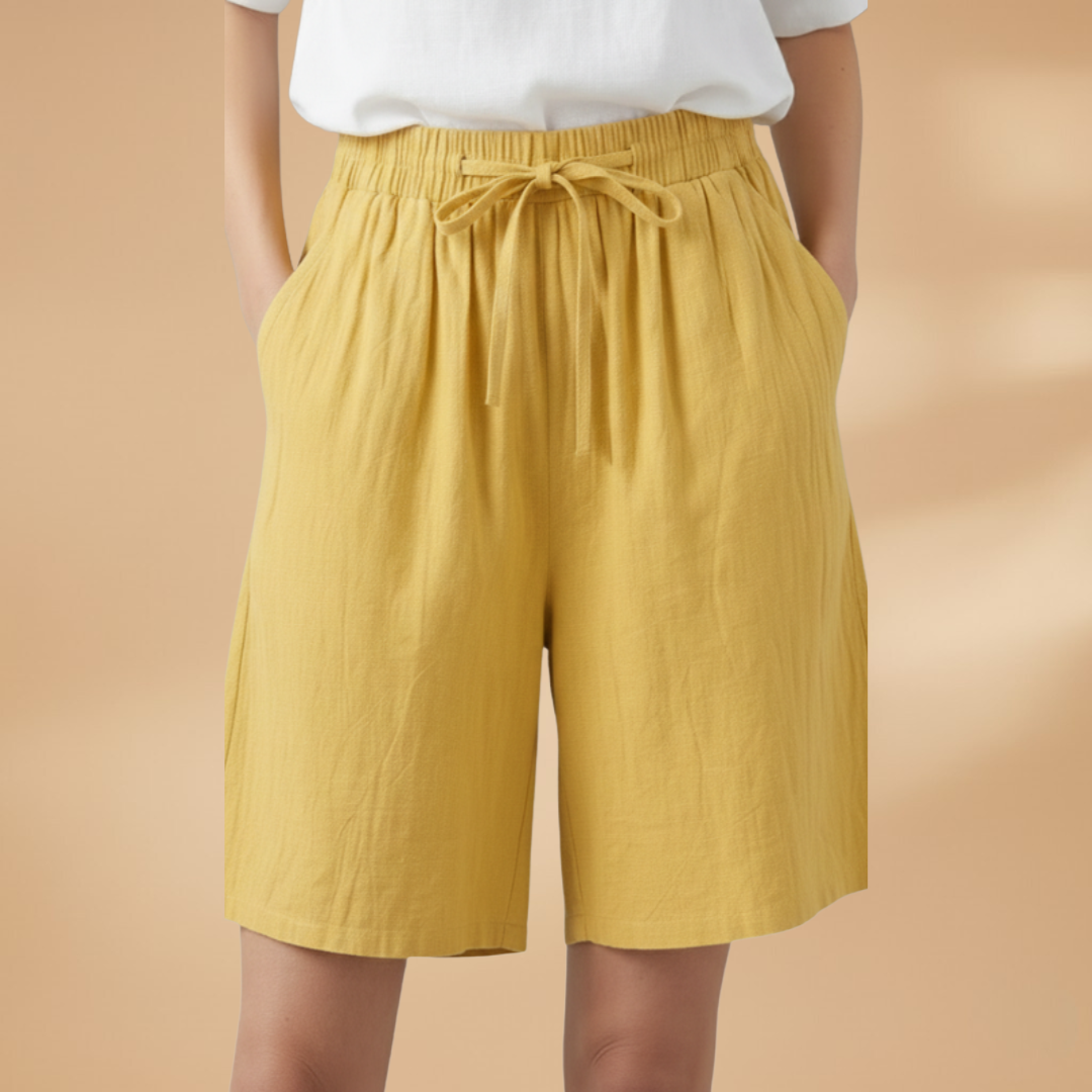 Women's relaxed fit knee-length shorts in a stylish design, perfect for casual outings and summer wear. 0
