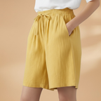 Women's relaxed fit knee-length shorts in a stylish design, perfect for casual outings and summer wear. 4