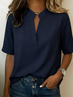 Women's relaxed fit V-neck blouse in a lightweight fabric, perfect for summer wear, featuring short sleeves and a comfortable, casual style ideal for everyday outfits. 1