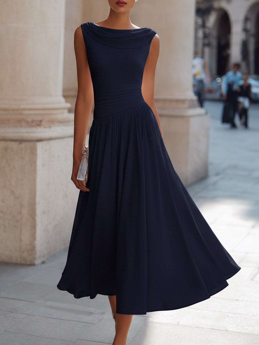 Women's sleeveless pleated midi dress in plus size, perfect for formal cocktails, featuring a flattering silhouette and elegant design. 1