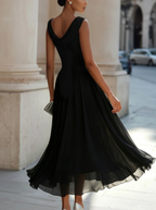 Women's sleeveless pleated midi dress in plus size, perfect for formal cocktails, featuring a flattering silhouette and elegant design. 5