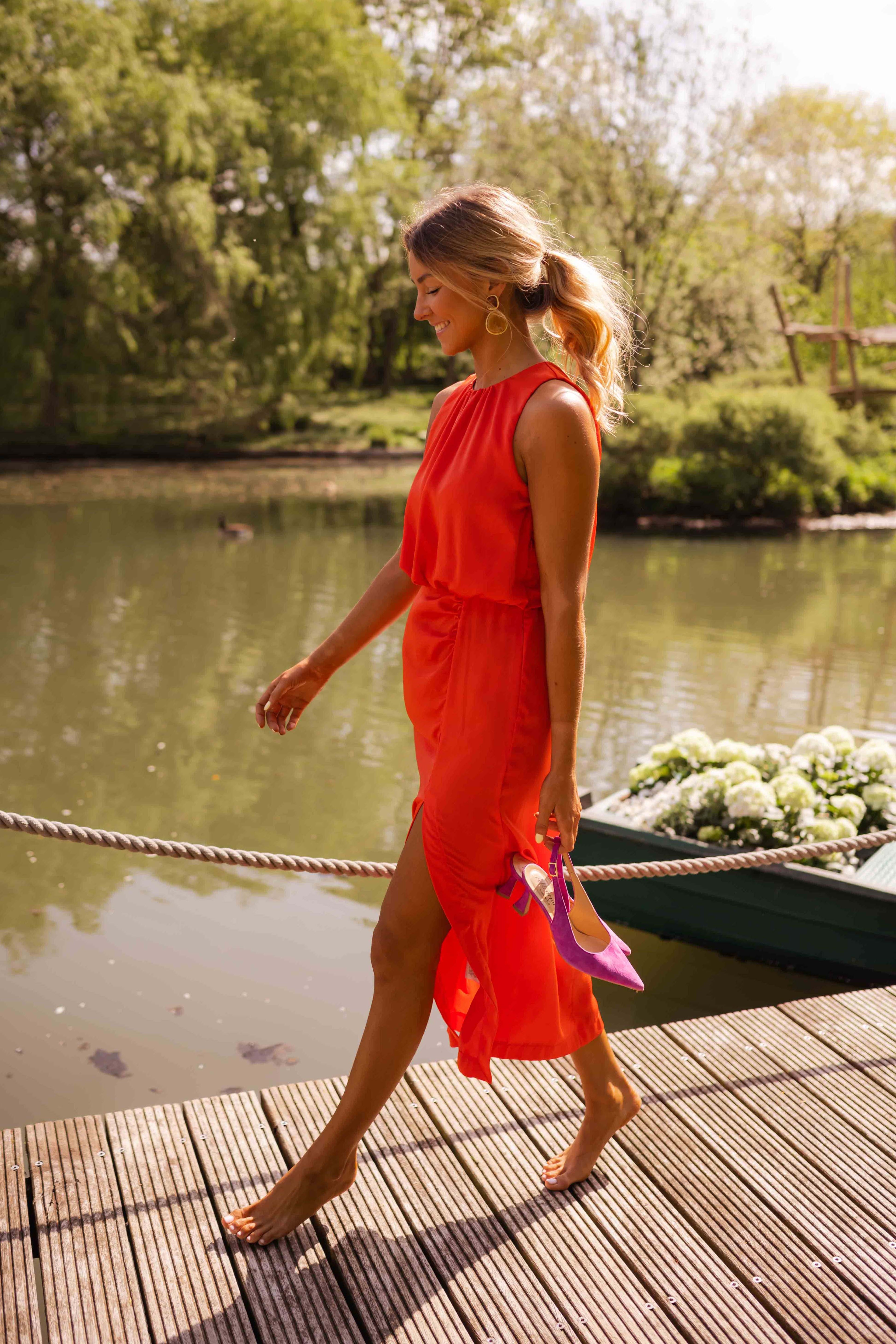 Women's slim fit midi dress featuring a sleeveless design and high neckline, perfect for summer occasions. 3